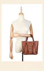 Brown leather handbag featuring retro rivet and woven handle details for women 2025 style.