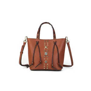 Genuine leather bucket bag with braided top handle, vintage rivet design, main product view.