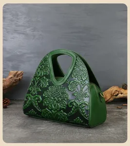 Vintage embossed genuine leather handbag for women, elegant dark green top handle tote bag.
