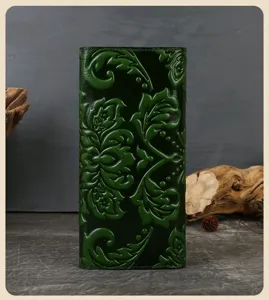 Green embossed leather long wallet detailed view, premium floral carved purse for women.