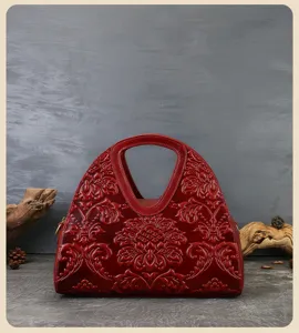 Vintage embossed leather handbag for women, ethnic style retro top handle shoulder bag.