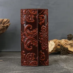 Women genuine leather long trifold wallet with vintage embossed floral design and large capacity.