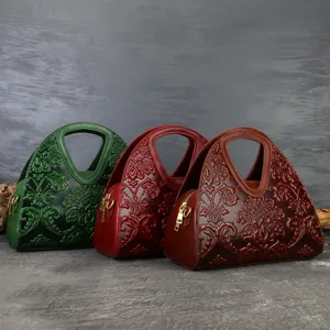 Vintage embossed leather handbag for women, elegant retro top handle shoulder crossbody bag.