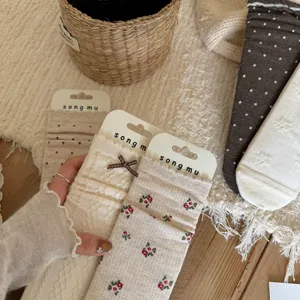 Spring vintage floral bow polka dot aesthetic stack socks detail display close-up style