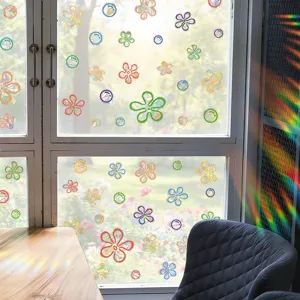 Detail view of colorful PVC static window stickers featuring ocean bubble and flower laser designs.