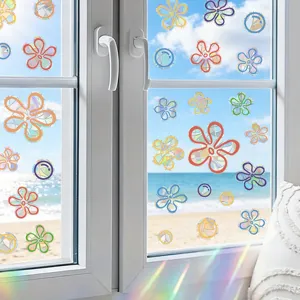 Detailed view of colorful laser flower and bubble static window stickers on glass for summer.