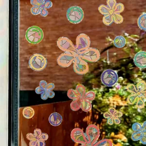 Colorful laser window stickers featuring floral and bubble static clings for home glass.
