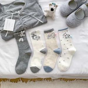 Cute cartoon animal embroidery women mid tube socks set with plush toy and cardigan background.