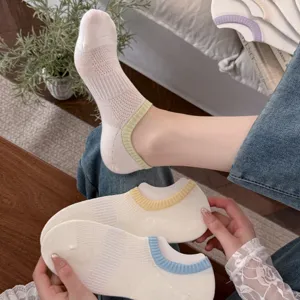 Detail shot of women's mesh low-cut socks with colorful ribbed cuffs, breathable daily wear.