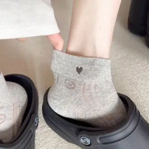 Breathable summer women grey low cut socks with cute heart embroidery and mesh design detail.