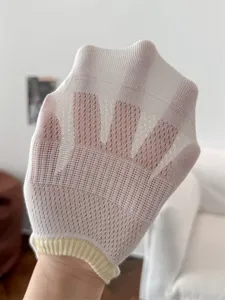 Close-up detail of ultra-thin mesh women boat socks with yellow ribbed cuff for breathable summer wear.