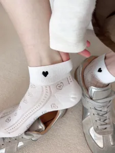 Women breathable short socks with cute black heart embroidery and subtle jacquard patterns.