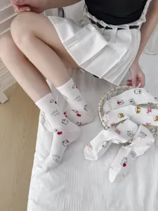 Cute cartoon print white mid-tube socks for women, sweet Japanese style daily wear.