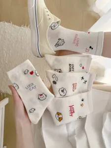 White cute cartoon printed mid tube socks detail showcasing embroidery designs and soft cotton fabric.