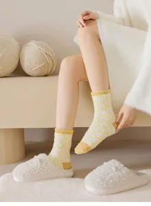Cozy checkered fuzzy socks detail view, thick soft coral fleece sleep socks for warmth.