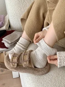 Detailed view of cozy wool knit socks for women, thick thermal winter stacking socks.
