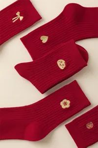 Red cotton socks for women, Chinese New Year zodiac theme with cute golden embroidery details.