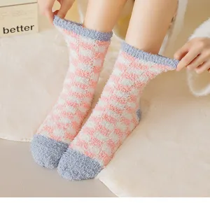Plush checkerboard sleep socks detail close-up, showing soft texture and elastic cuff fit.