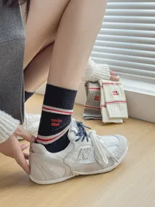 Cozy knit mid-calf socks with cute embroidery stripes, soft daily casual hosiery for women.
