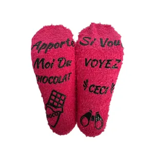 Cozy pink fuzzy fleece socks with fun grip text on soles, warm winter sleeping floor socks.