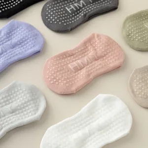 Non-slip yoga socks with silicone grip dots detail, perfect for pilates and dance practice.