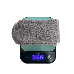 Thickened grey coral velvet fuzzy sleep floor socks detail showing weight display on electronic scale.