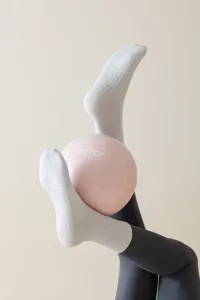 Non-slip grip yoga socks for women, mid-tube cotton pilates fitness socks with silicone dots.