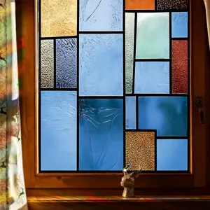 Detail of retro stained glass window film, colorful geometric light effect on glass window.