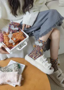 Cozy fuzzy winter socks for women, thick plush warm mid-calf knit socks with cute bow decor.