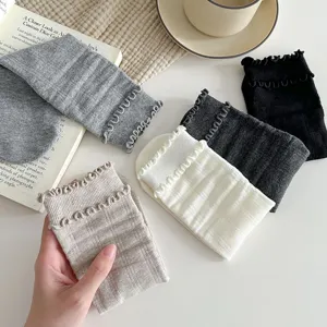 Detailed shot of comfortable cotton socks with cute lettuce ruffle edges in multiple colors.