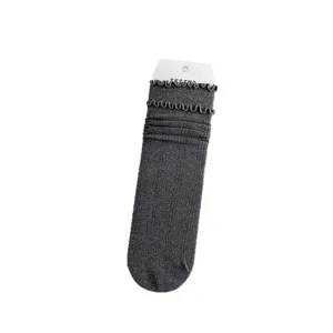 Dark grey ruffed mid-calf socks for women, stylish stacked cotton knit casual hosiery.