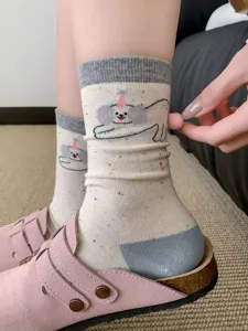 Cute cartoon dog mid-tube socks for women with lovely pom-pom accessory, soft and cozy daily wear.