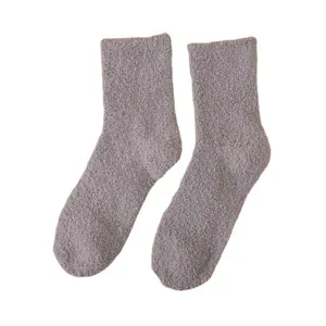 Soft and cozy coral fleece fuzzy socks detail view, perfect winter warm solid mid-tube socks.