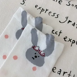 Cute cartoon rabbit cotton mid-tube socks featuring 3D ears and sweet pink polka dot details.