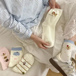 Cute cartoon embroidered mid-tube socks detail view, soft cotton casual daily wear.