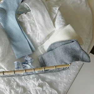 Close up view of breathable ribbed mid-calf slouch socks in various colors for daily wear.
