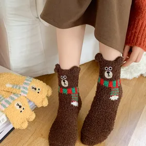 Cute fuzzy coral fleece winter floor socks with 3D bear ears and warm scarf design.