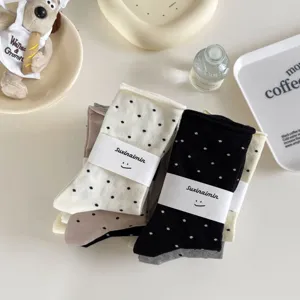 Casual polka dot mid-tube stacked socks set with cute paper band packaging, soft and comfortable.