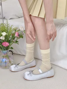 Women's sheer hollow out calf socks with silver ballet Mary Jane flat shoes detail.