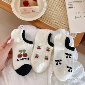 Cute cherry pattern mesh short socks detail showing breathable summer low cut white socks design.