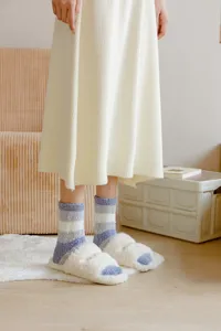 Women winter cozy striped coral fleece thick warm sleeping socks for indoor home floor wear.