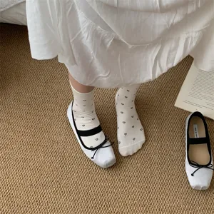 Detail view of women summer thin mid-tube socks with cute heart jacquard ballet aesthetic.