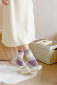 Cozy fuzzy striped warm winter socks for women, soft fleece home floor socks detail.