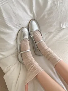 Silver Mary Jane flats with beige mesh scrunched socks, stylish Japanese daily footwear detail.