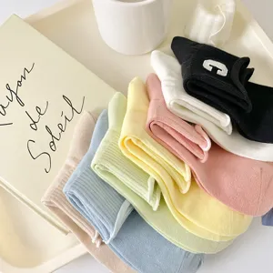 Women pastel cotton ankle socks set featuring cute letter embroidery and comfortable loose cuffs.