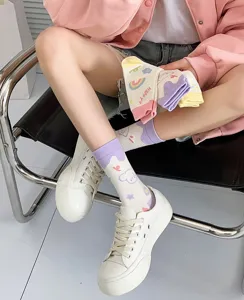 Close-up detail of cute cartoon bunny printed mid-calf socks for women, spring summer style.