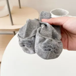 Detailed view of grey non-slip low cut boat socks showing silicone grip pattern on sole.