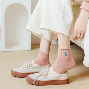 Close-up detail shot of women's comfortable cotton short socks featuring cute embroidered letter.