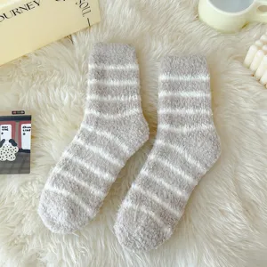 Cozy grey white striped fuzzy coral fleece socks detail shot, soft warm winter sleep socks.
