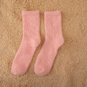 Detailed view of cozy pink fuzzy coral fleece socks, soft winter warm sleep floor socks.